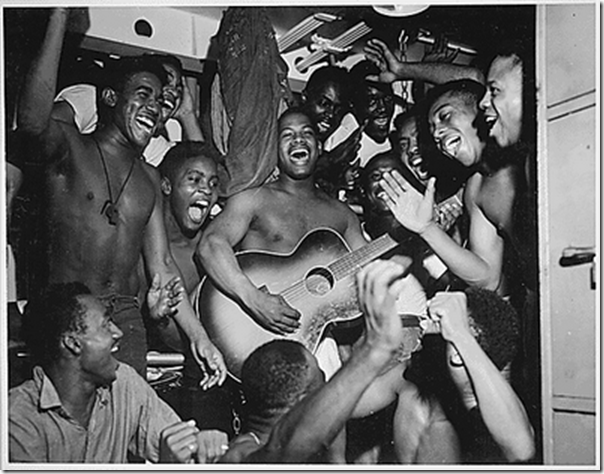 sailors abourd the USS Ticonderoga (CV-14) celebrate the surrender of japan